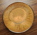 Metal bowl with Chinese 5 Spice mix on a wooden surface
