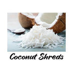 Coconut shreds with a halved coconut on a white background