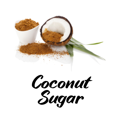 Coconut sugar in a small white bowl and on a white surface with a coconut half, on a white background.