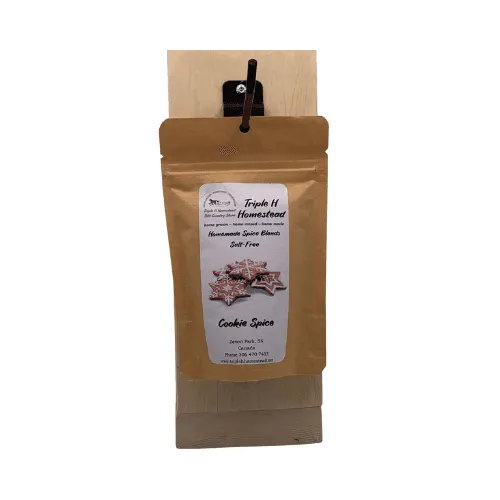 Kraft paper packaging with a label for 'Triple H Homestead' cookie spice blend on a white background.