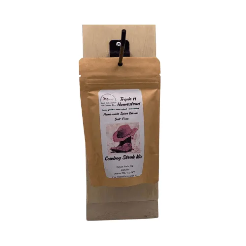 Brown package of cowboy steak mix with a label on a white background