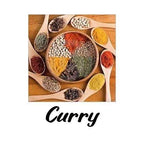 Spices in a wooden bowl with wooden spoons on a white background, labeled 'Curry'.