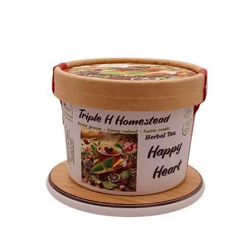 Container of Triple H Homestead Happy Heart Herbal Tea on a white background