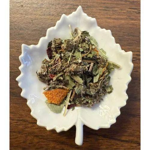 Invigorating Ice Tea mix on a decorative white plate on a wooden surface