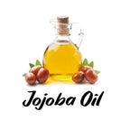Bottle of jojoba oil with jojoba seeds on a white background