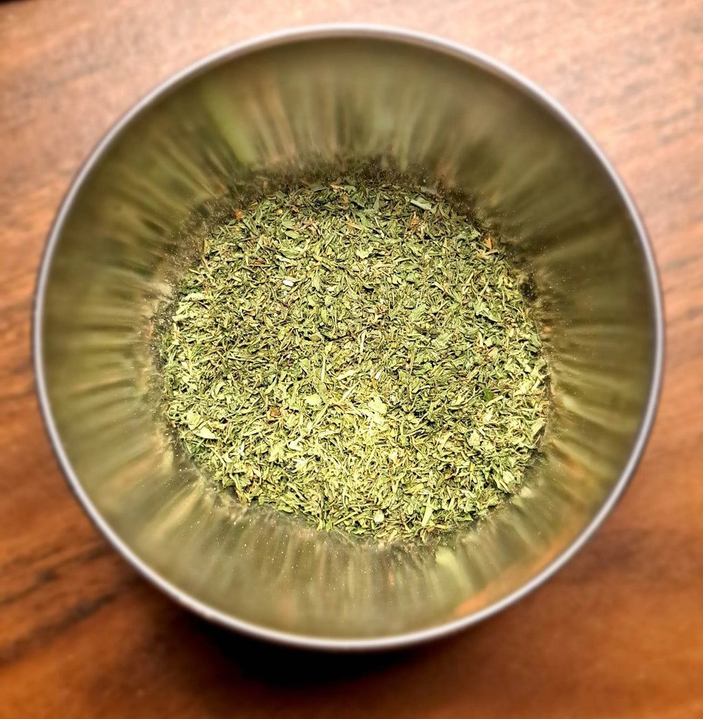 Metal bowl filled with Lemony Dill Mix on a wooden surface