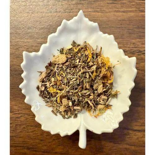Lymph Support Herbal tea leaves in a white ceramic bowl on a wooden surface