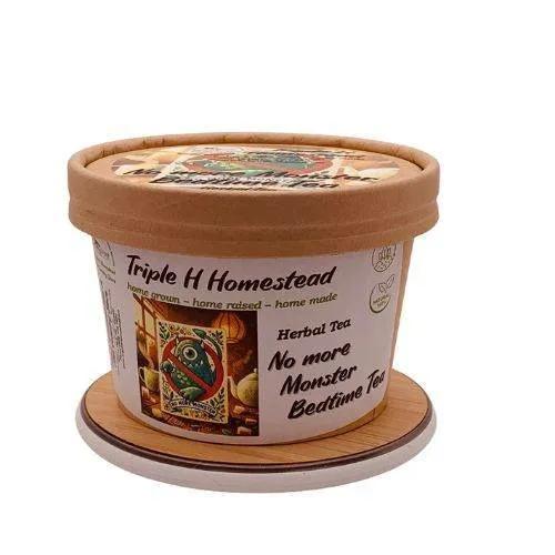 Container of Triple H Homestead herbal tea with decorative lid on a white background