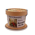 Container of Triple H Homestead Herbal Tea with decorative lid on a white background