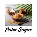 Palm sugar with a coconut and palm leaf on a gray surface
