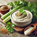 Cottage cheese dip with herbs and spices on a wooden board