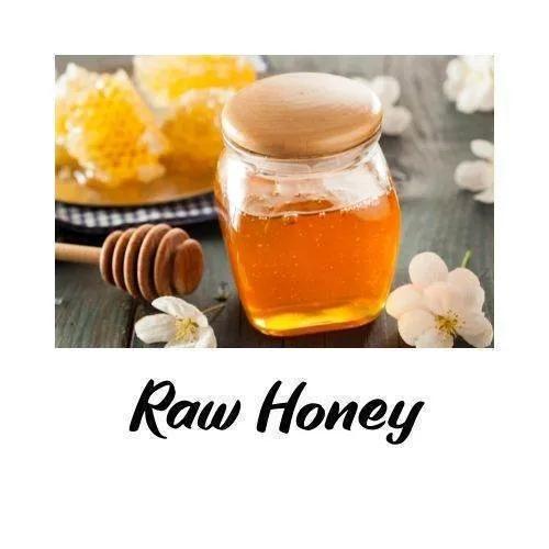 Jar of raw honey with a wooden lid on a wooden surface, surrounded by honeycomb and flowers, with 'Raw Honey' text overlay.