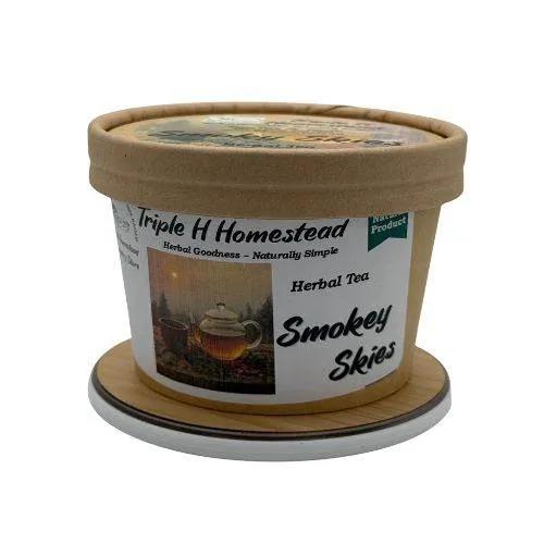 Container of Triple H Homestead Smokey Skies Herbal Tea on a white background