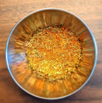 Metallic bowl filled with Southwest Chipotle on a wooden surface