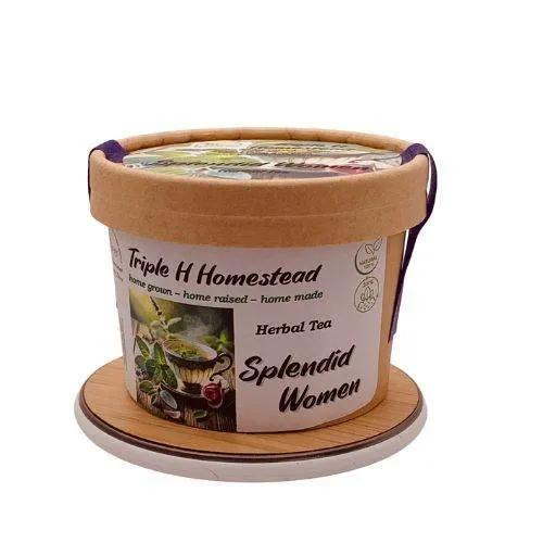 Container of Triple H Homestead herbal tea with decorative lid on a white background