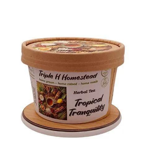 Tropical Tranquility herbal tea container with decorative lid on a white background