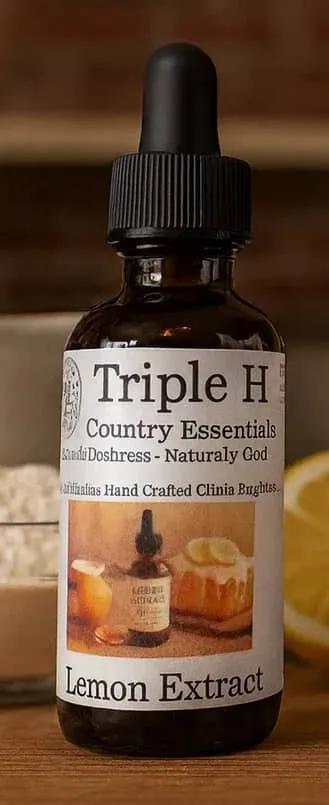 Bottle of Triple H Lemon Extract on a wooden surface with a blurred background
